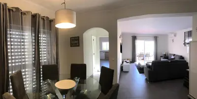 a living room with a glass table and a couch at Casa Netos in Galé