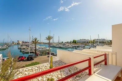 a view of a marina with boats in the water at Onde a Marina é Casa T2 HsR Vilamarina in Vilamoura