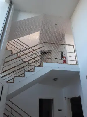 a staircase in a room with a ceiling at Villa dos Salgados - Beachfront, 6 Golf Courses, 6BDR in Guia