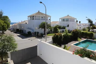 a view of a house and a swimming pool at Villa dos Salgados - Beachfront, 6 Golf Courses, 6BDR in Guia