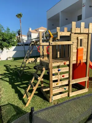 a playground with a ladder and a play structure at Villa dos Salgados - Beachfront, 6 Golf Courses, 6BDR in Guia