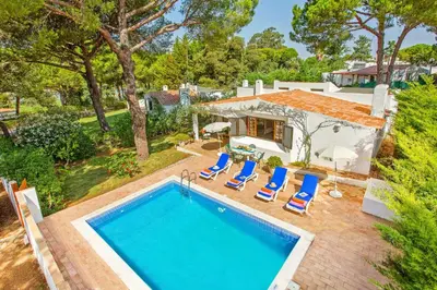 an aerial view of a house with a swimming pool at Villa Simão in Quinta da Balaia in Albufeira