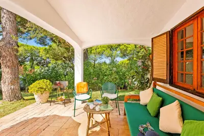 a bathroom with a sink and a tub and a toilet at Villa Simão in Quinta da Balaia in Albufeira