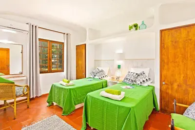 a bathroom with a toilet and a sink and a shower at Villa Simão in Quinta da Balaia in Albufeira