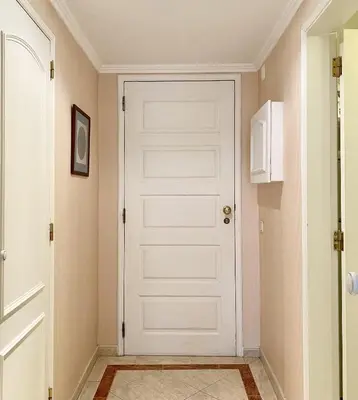 a white door in a hallway with at Marina Mar - Near the beach - Vilamoura in Vilamoura