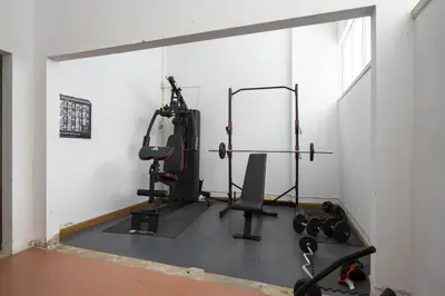 a room with a gym with two tread machines at Marina Mar - Near the beach - Vilamoura in Vilamoura