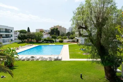 an image of a swimming pool in a park at TAC - Vilamoura Center in Vilamoura
