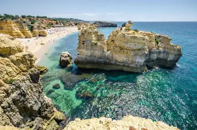 an aerial view of a beach with rocks and the ocean at Villa Hideaway by Algarve Villa Holidays in Galé
