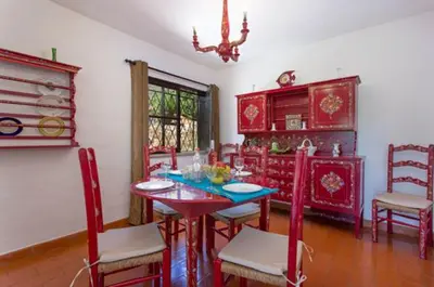 a patio with two chairs and a swimming pool at Villa EP in Albufeira