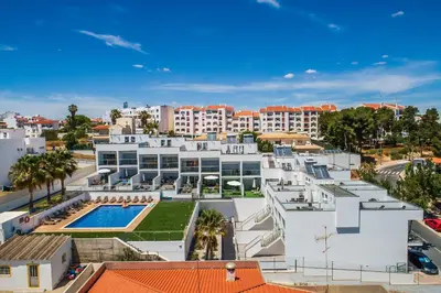 an aerial view of a building with a swimming pool at Praia Mar by OCvillas in Albufeira
