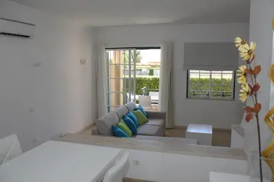 a bathroom with a toilet and a sink at Villa V2 AA in Olhos de Água