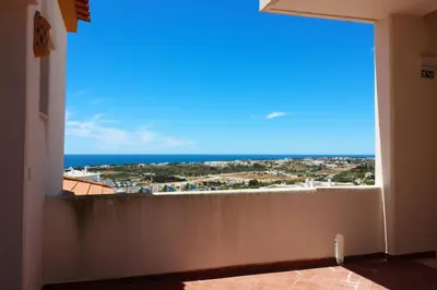a view of the ocean from the balcony of a house at Bellavista Jardim By BeGuest in Albufeira