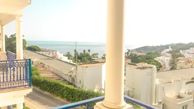 a view of the ocean from a balcony of a building at Apartamentos Praia da Oura by Sunny Deluxe in Albufeira