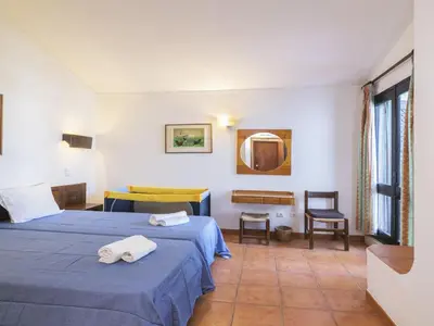 a hotel room with two beds with towels on them at Villa Villa Jacaranda V3 by Interhome in Albufeira