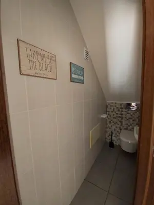 a bathroom with a sign that reads take me out the bush at Casa Flor de Sal - moradia no Centro de Faro! in Faro