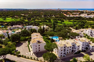 an aerial view of a villa with a resort at Vilamoura Oasis Family Duplex in Vilamoura