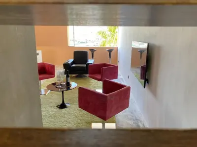 a view of a waiting room with chairs and a table at Vilamoura Marina Mezzanine Loft in Vilamoura