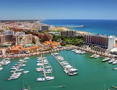 a group of boats are docked in a harbor at Vilamoura Marina Mezzanine Loft in Vilamoura