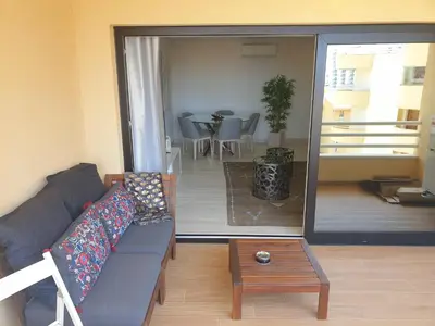 a white laundry room with a washer and dryer at Marina Mar Vilamoura Apartment in Vilamoura
