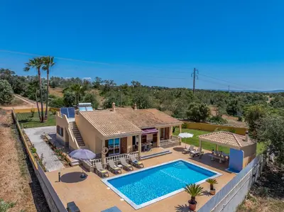 an aerial view of a house with a swimming pool at Villa Monte Velho in Albufeira