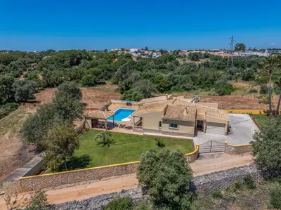 an aerial view of a house with a yard at Villa Monte Velho in Albufeira