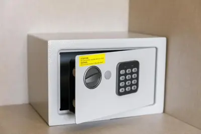 a white microwave with a yellow sticker on it at AlbufeiraMar Apartment in Albufeira