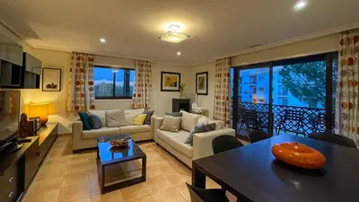 a living room with a couch and a table at T2 Apartment Falesia Beach Albufeira in Roja- Pé