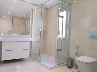 a bathroom with a shower and a sink and a toilet at Villa Ray Design in Albufeira