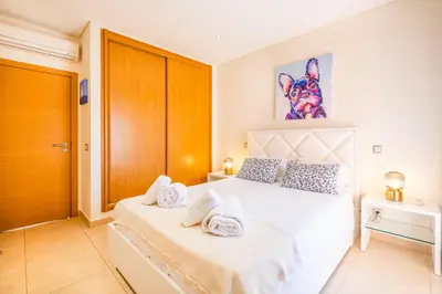 a bedroom with two beds with towels on them at Cozy villa with pool and Barbecue in Albufeira