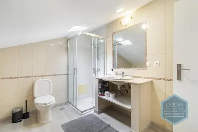 a bathroom with a toilet and a shower and a sink at Old Town - Albufeira - Dream Lodging in Albufeira