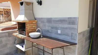 a kitchen with a sink and a stove at Sea view Penthouse 10 min walking Albufeira old town and Beach Pescadores in Albufeira