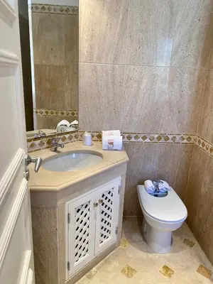 a bathroom with a sink and a toilet at Beautiful apartment for rent in Quinta do Lago with excellent resort facilities close to lake and beach. in Quinta do Lago