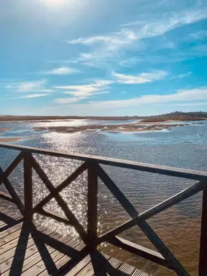a view of the ocean from a pier at Beautiful apartment for rent in Quinta do Lago with excellent resort facilities close to lake and beach. in Quinta do Lago
