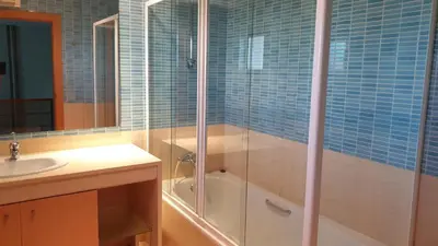 a bathroom with a shower with a tub and a sink at Luxury city Villa Olivia 10 - 15 min to the Beach Oura, private swimming pool in Albufeira