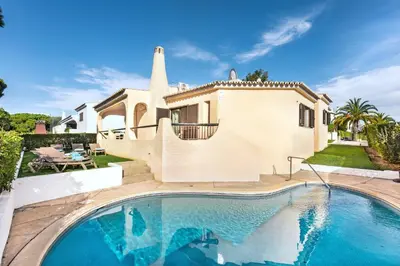 a bathroom with a sink and a tub and a mirror at Old Village Area and close to all amenities, Overlooking Golf Course in Quarteira
