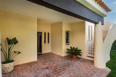 a bathroom with a sink and a toilet and a mirror at Old Village Area and close to all amenities, Overlooking Golf Course in Quarteira