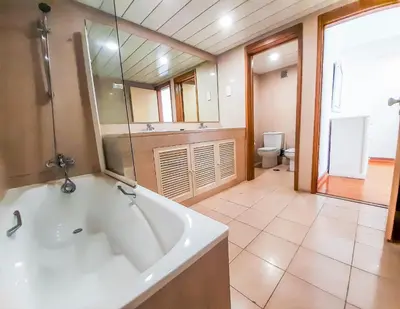 a large bathroom with a tub and a toilet at Por do Sol Dourado T2 HsR Vilamarina in Vilamoura