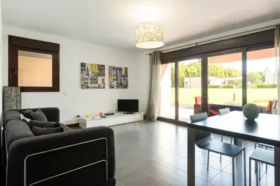 a living room with a couch and a table at Apartamento Monte Laguna in Vilamoura