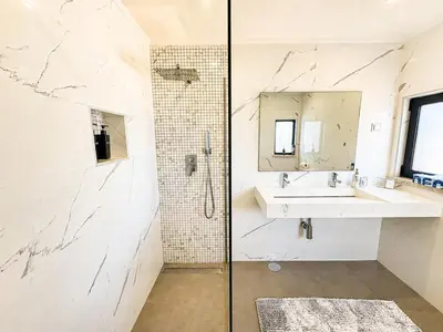 a bathroom with a shower and a sink at Villa Cristina 17 - 500 m from the Beach in Albufeira