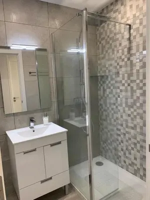 a bathroom with a shower and a sink and a mirror at Salgados Beach and Relax in Guia