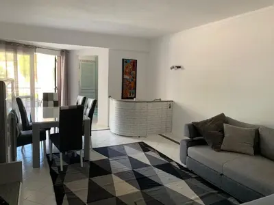 a living room with a couch and a table at Salgados Beach and Relax in Guia