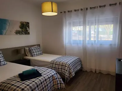 a room with two beds and a window at 