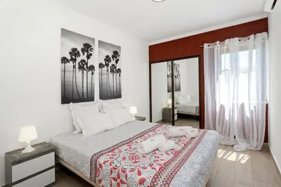 a bedroom with a bed with two stuffed animals on it at Elma By Albufeira Rental in Albufeira
