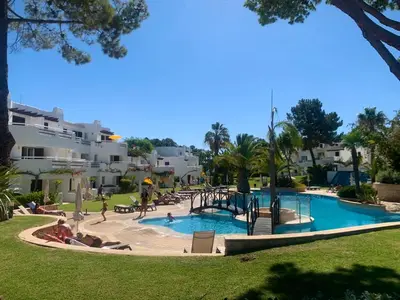 a swimming pool with a playground in a resort at Casa da Balaia - beach, pool, golf and tennis in Albufeira