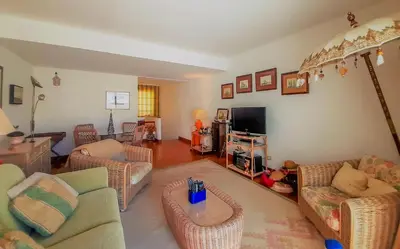 a living room with couches and a tv at Penthouse Triplex L25 T2 by HsR Vilamarina in Vilamoura