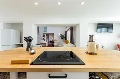 a kitchen with a wooden counter top with a sink at Villa AL Fresco in Guia