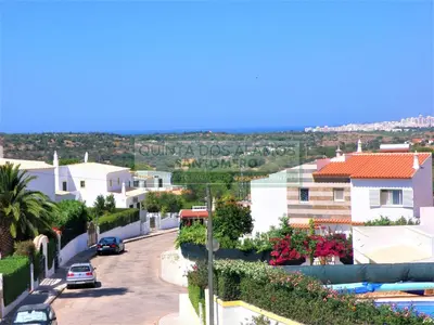 a view of a city street with cars driving down a road at Villa Catuna - Quinta do Jolu in Guia