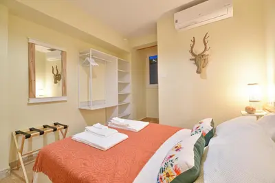 a bedroom with a bed with two towels on it at Elevator's Beach House by Atlantic Places in Albufeira
