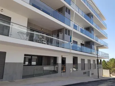 an external view of a building with a balcony at Alto do Forte Novo- Ar- Condicionado, Wifi, Vista Mar in Quarteira