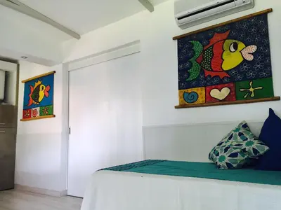 a bedroom with a bed and a painting on the wall at Amazing Algarve - Albufeira in Albufeira